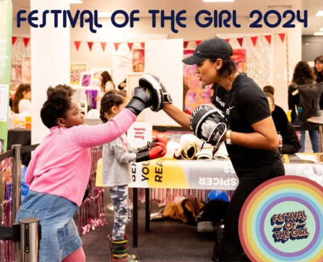 An attendee practing her boxing at one of the Festival of the Girl's many activities.